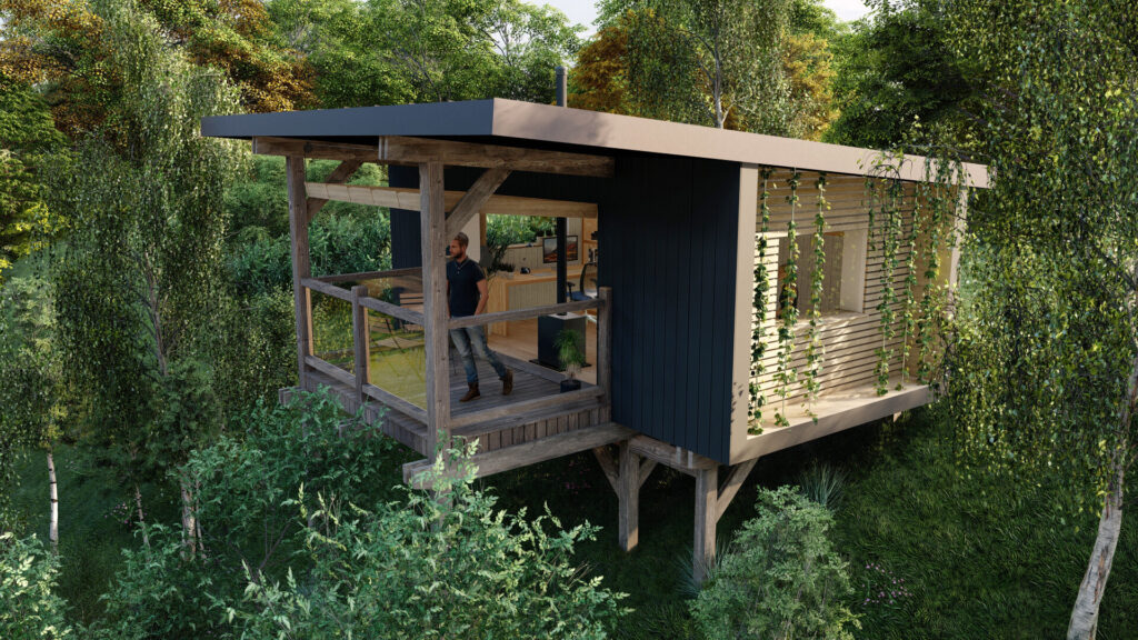 A modern treehouse with a slanted roof stands among green trees. It has a wooden deck, open sliding doors, and plants hanging along its side. A person is standing on the deck, looking out into the forest.